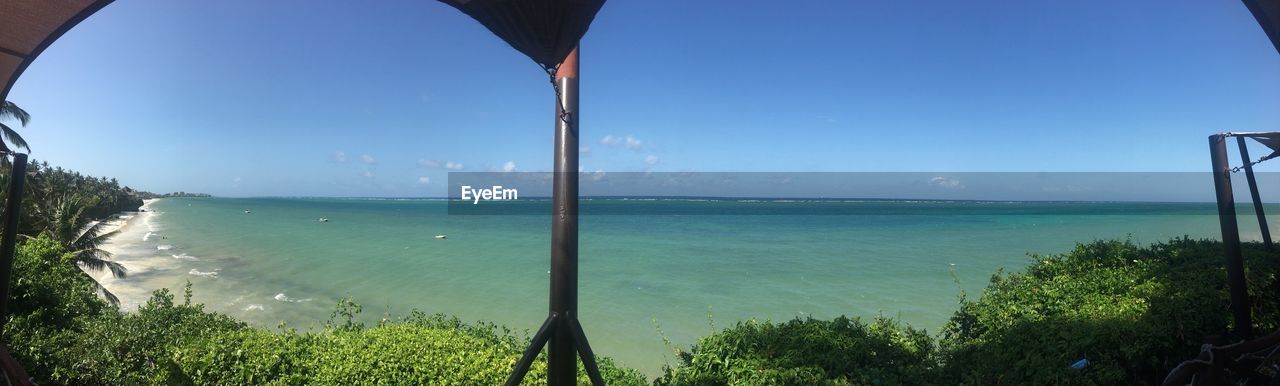 PANORAMIC VIEW OF SEA AGAINST CLEAR BLUE SKY