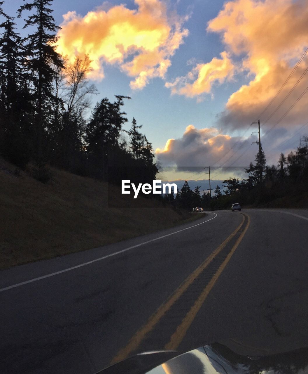 ROAD AGAINST SKY DURING SUNSET