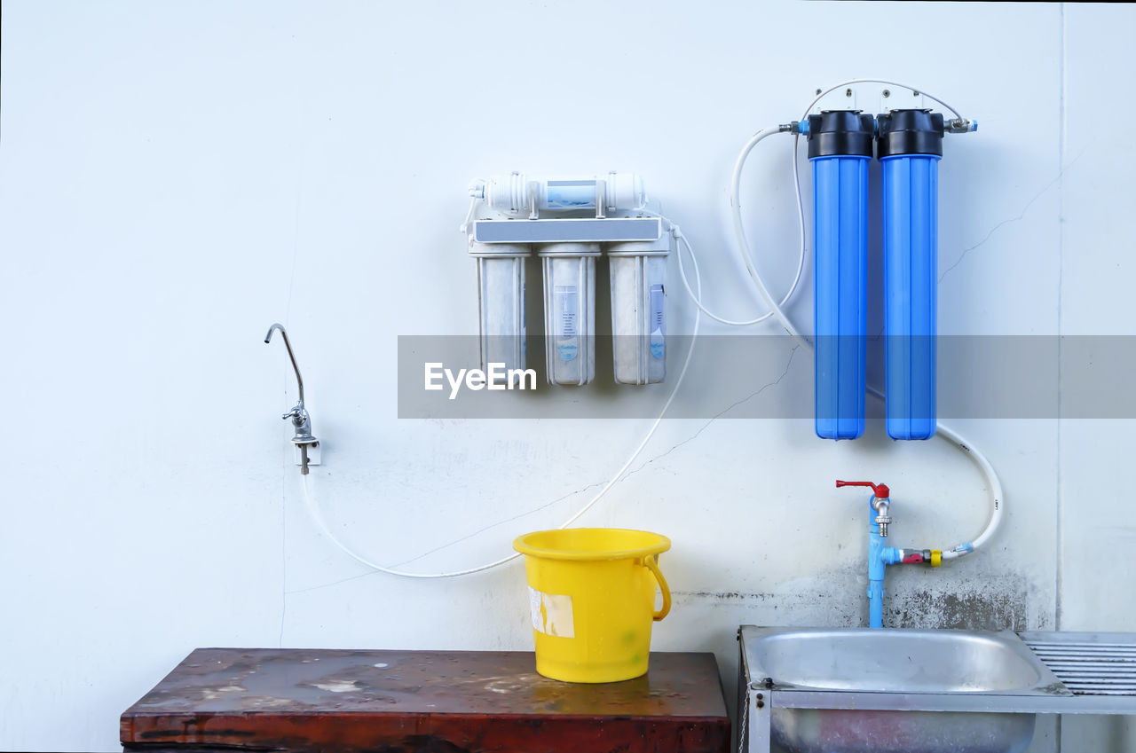 Close-up of water purifier on wall at home