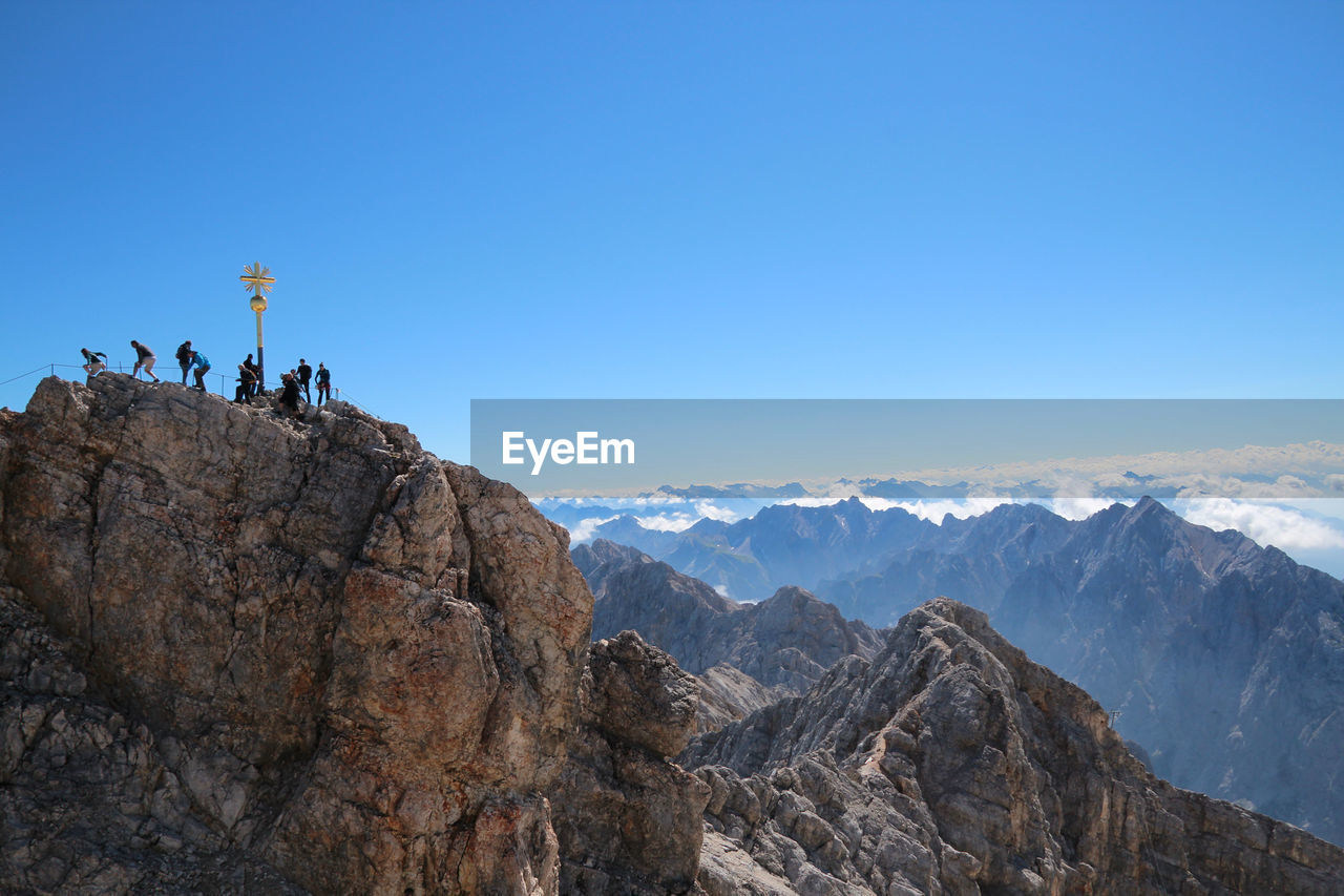 Scenic view of mountains against clear blue sky