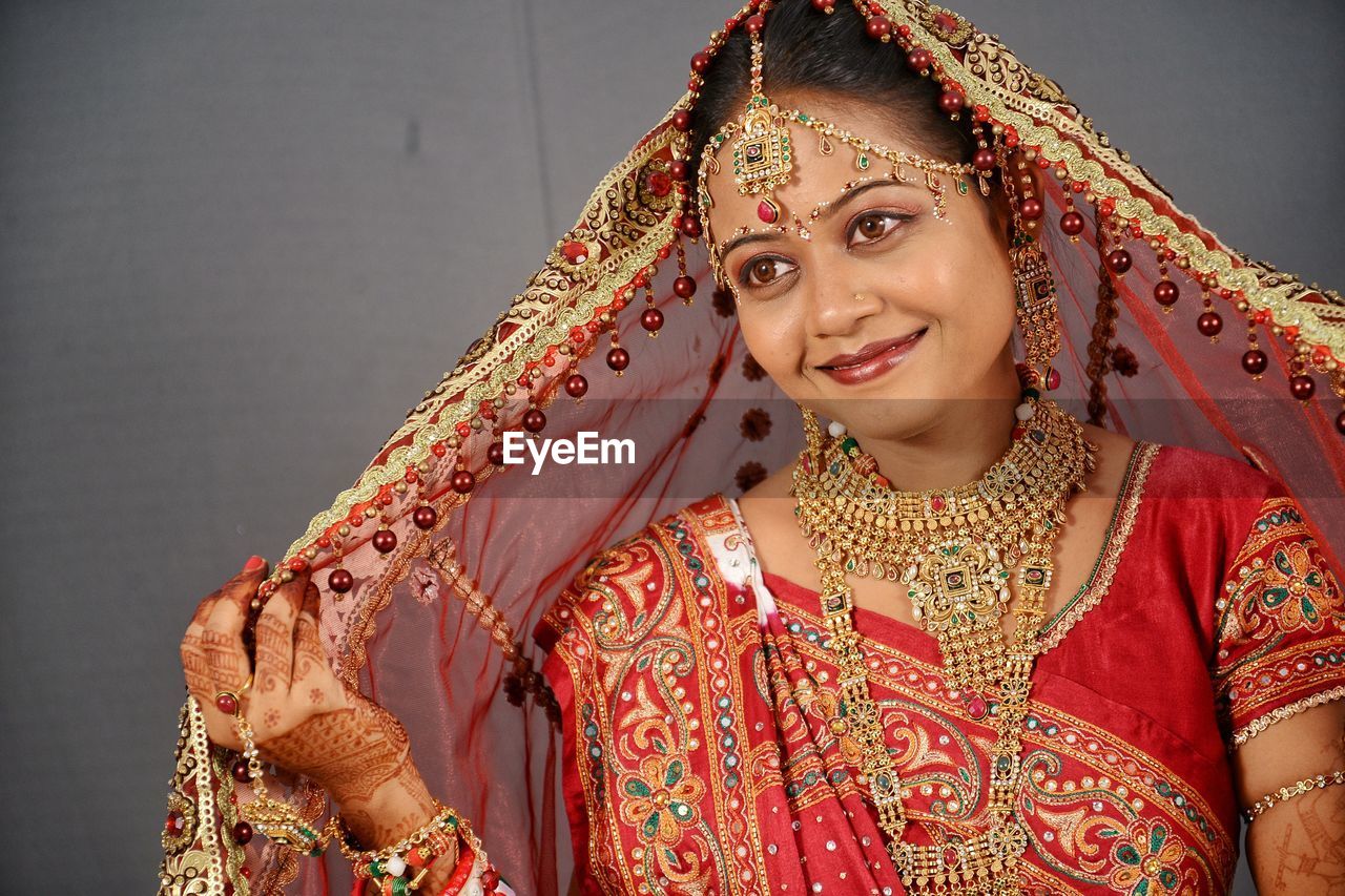 Close-up of smiling young bride at home 