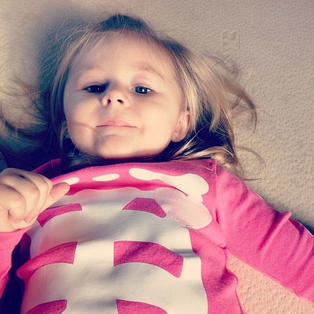 High angle view of little girl lying down