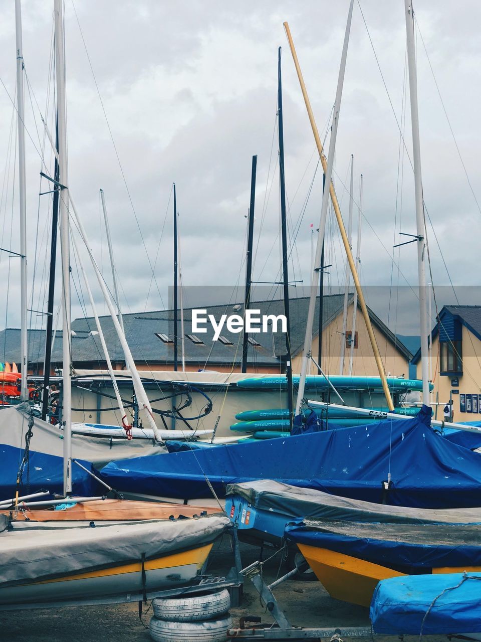 SAILBOATS MOORED IN MARINA