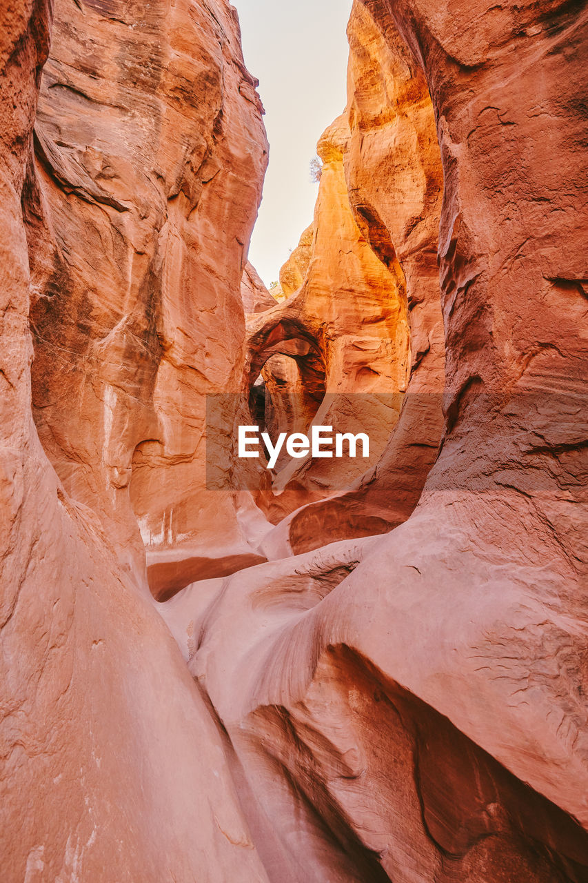 Narrow slot canyons in escalante, utah during summer roadtrip.