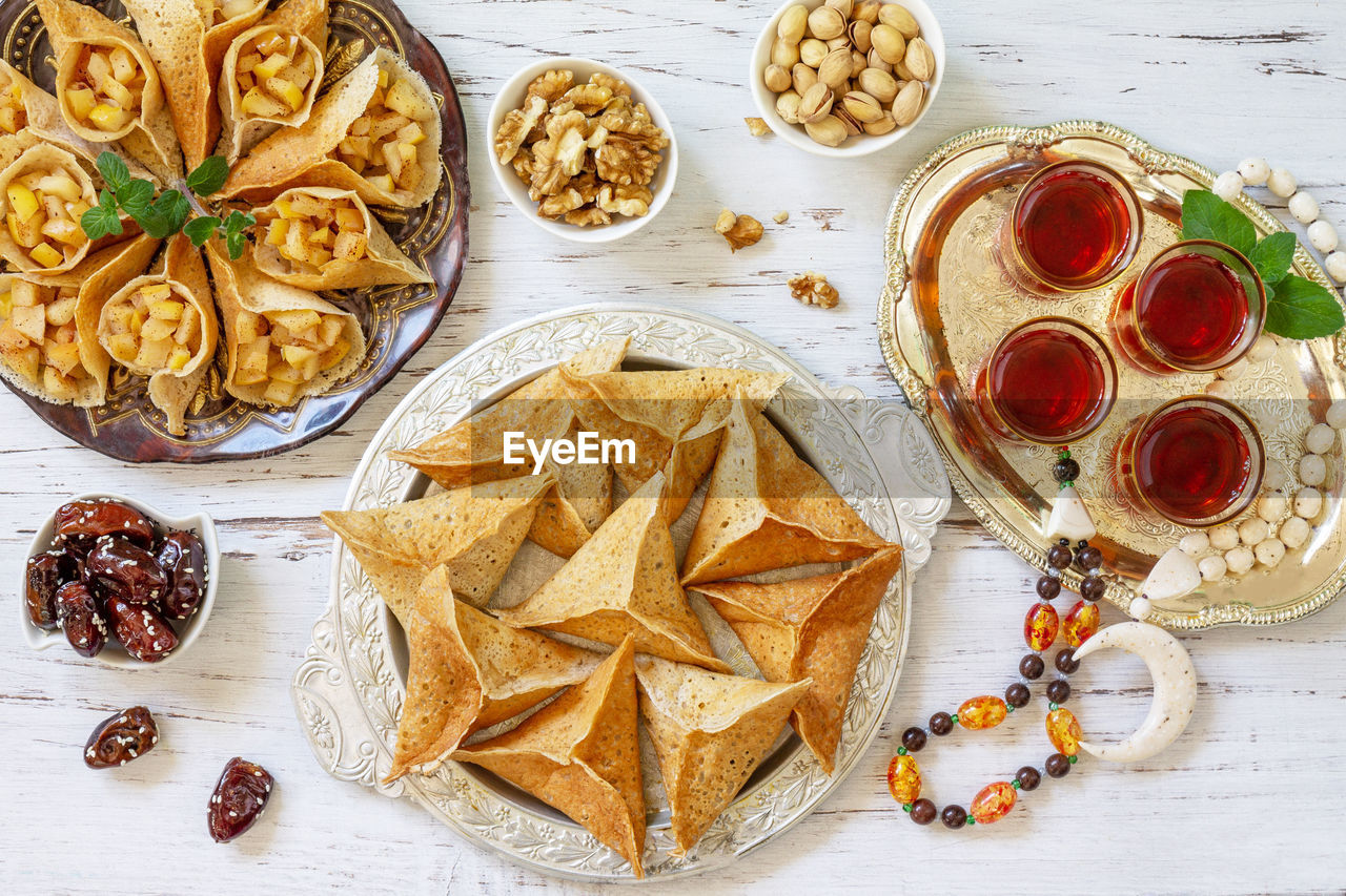 Ramadan kareem festive, fasting, halal food. ramadan menu assorted arabian pancake katayef 