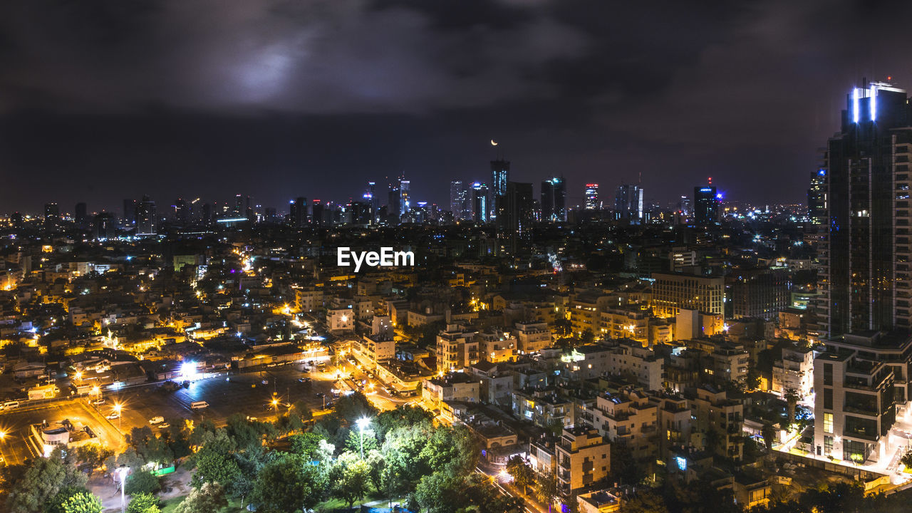 Aerial view of city lit up at night