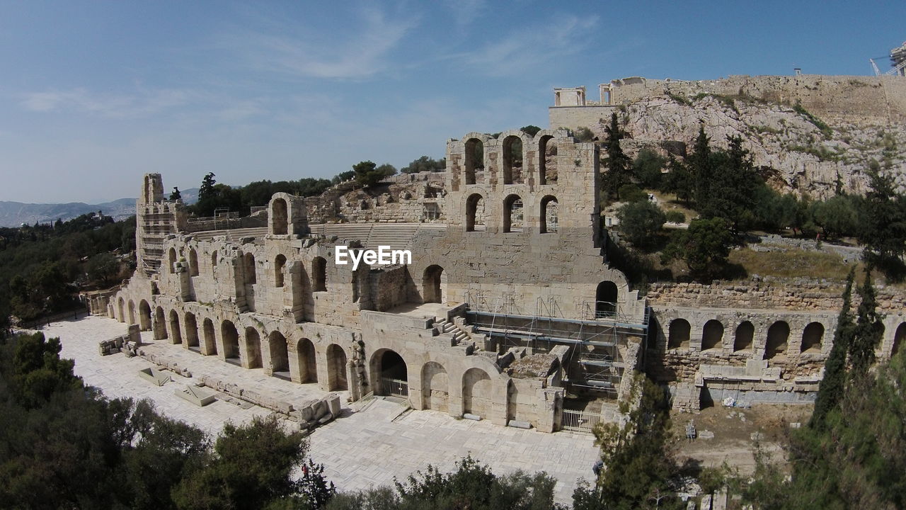 Abandoned amphitheater against blue sky