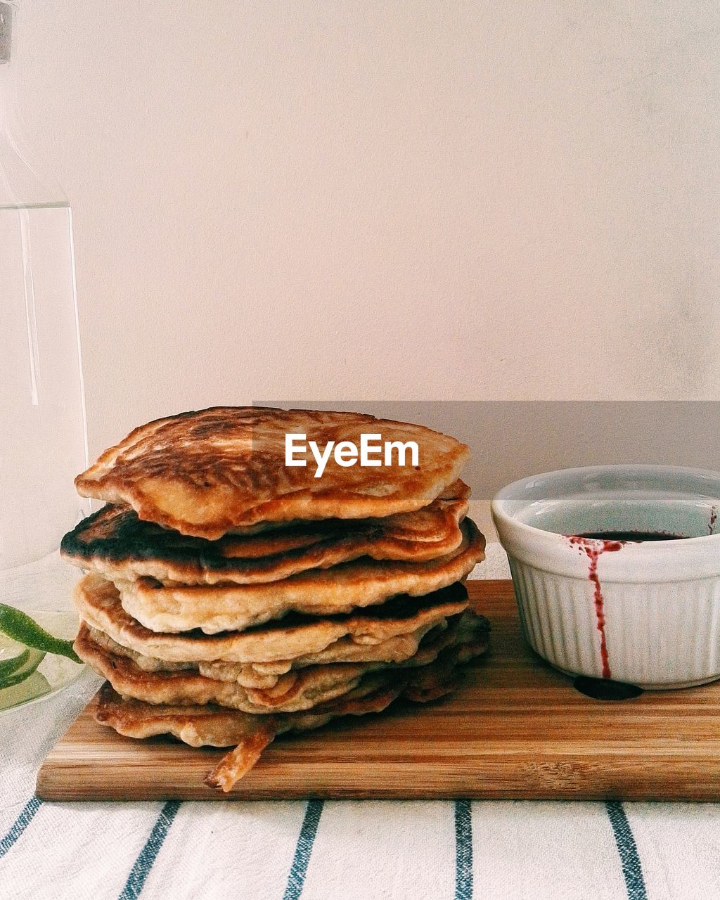 CLOSE-UP OF STACK OF TABLE