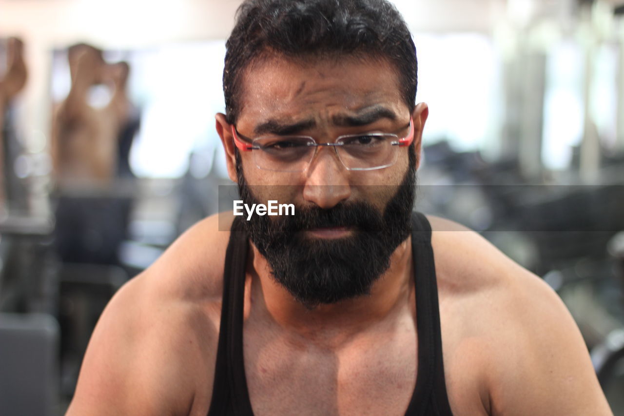 Portrait of bearded man in gym