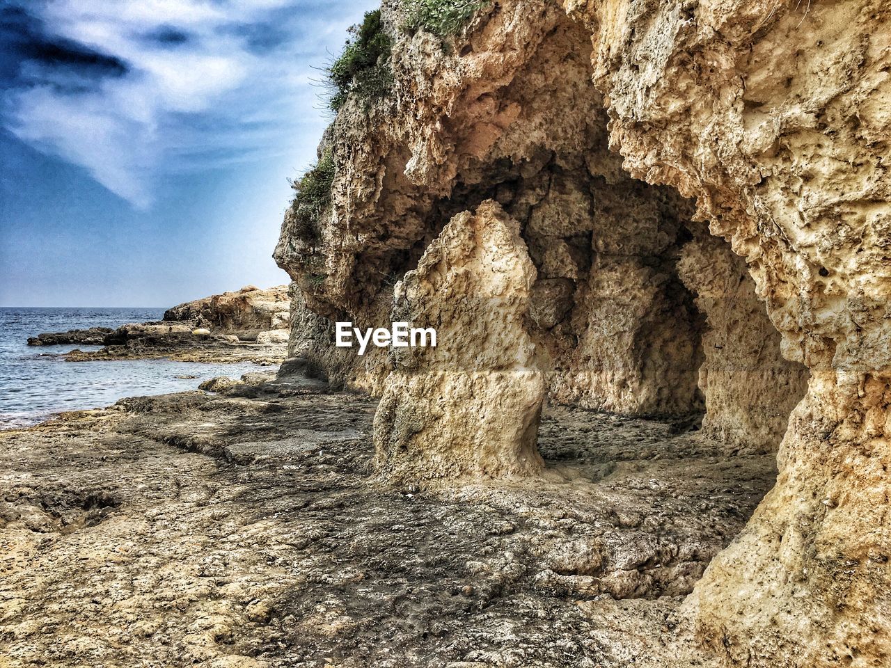 ROCK FORMATIONS ON BEACH