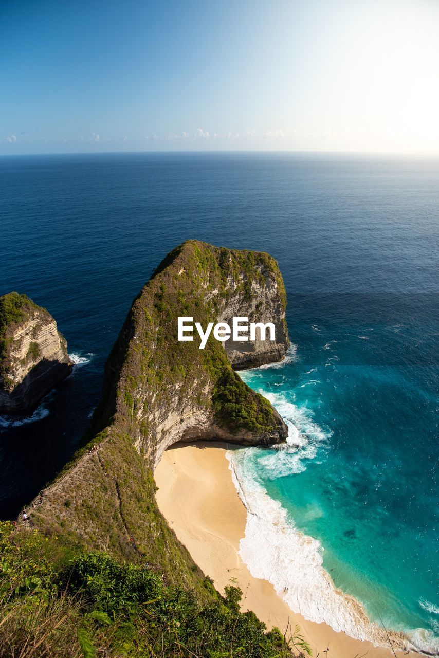 High angle view of rocks on beach against sky