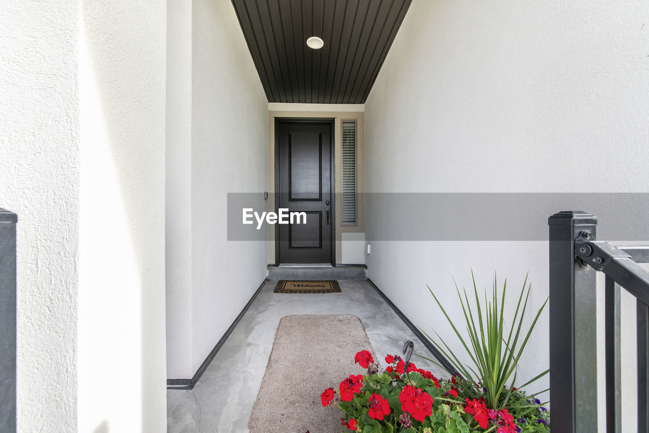 ENTRANCE OF BUILDING WITH RED AND WHITE WALL