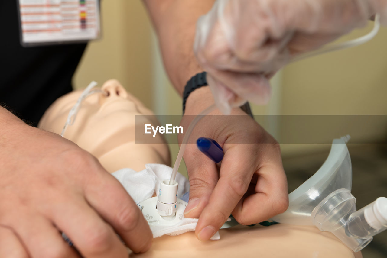 midsection of doctor examining patient