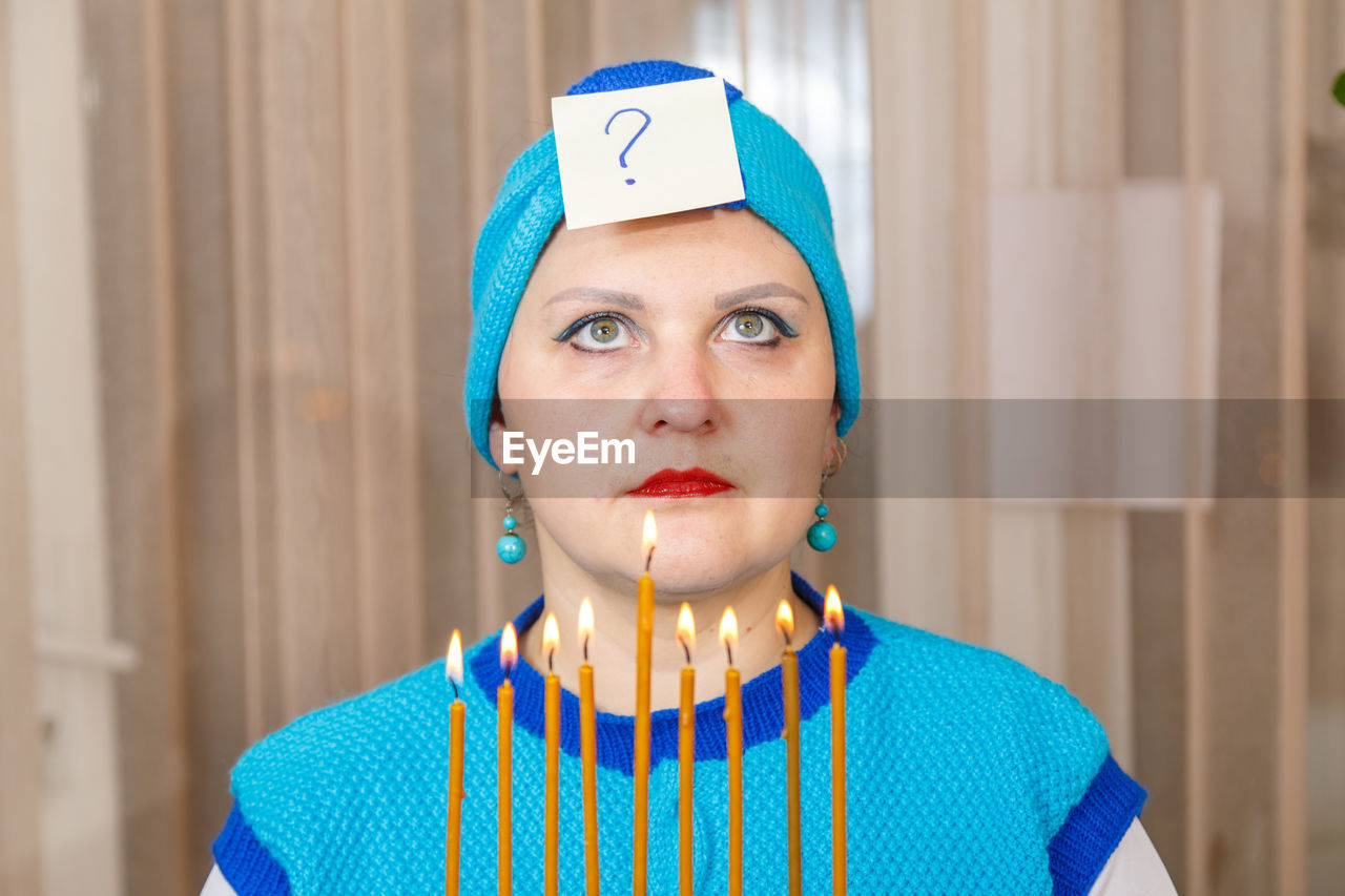 PORTRAIT OF YOUNG WOMAN WITH BLUE EYES