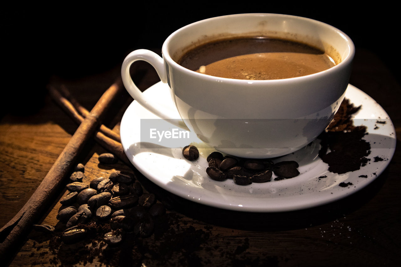 CUP OF COFFEE WITH TEA IN GLASS