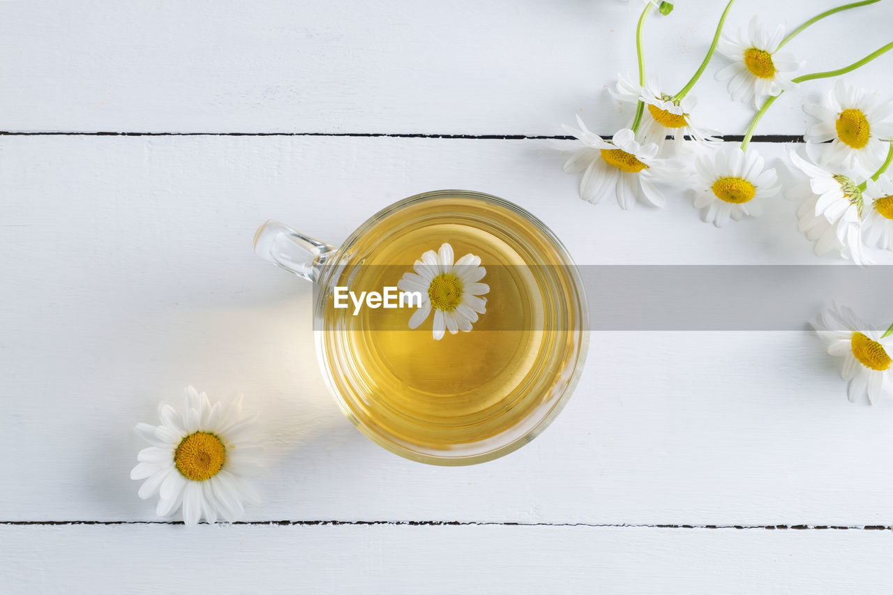 Close-up top view of a cup of chamomile tea. alternative and traditional medicine. herbal treatment. 