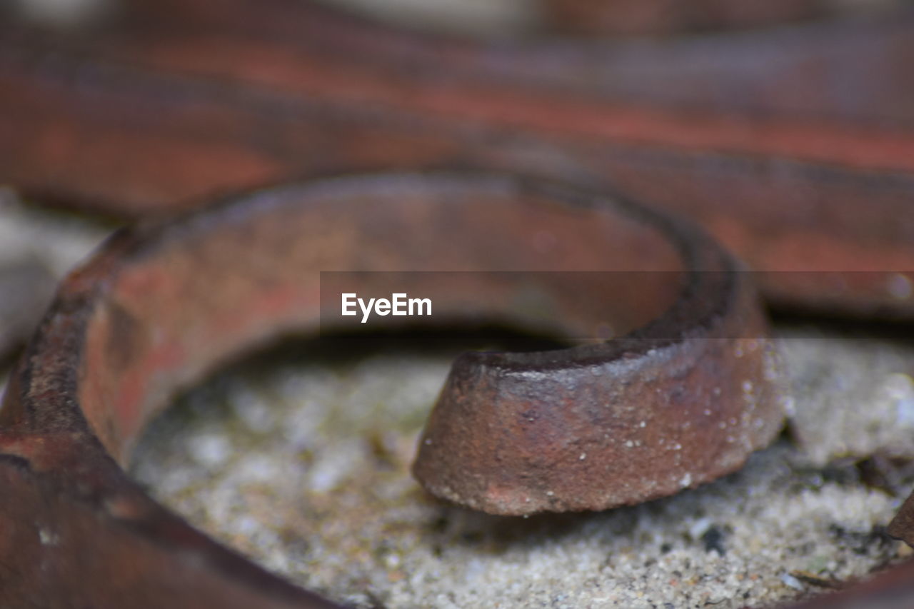 CLOSE-UP VIEW OF RUSTY WHEEL