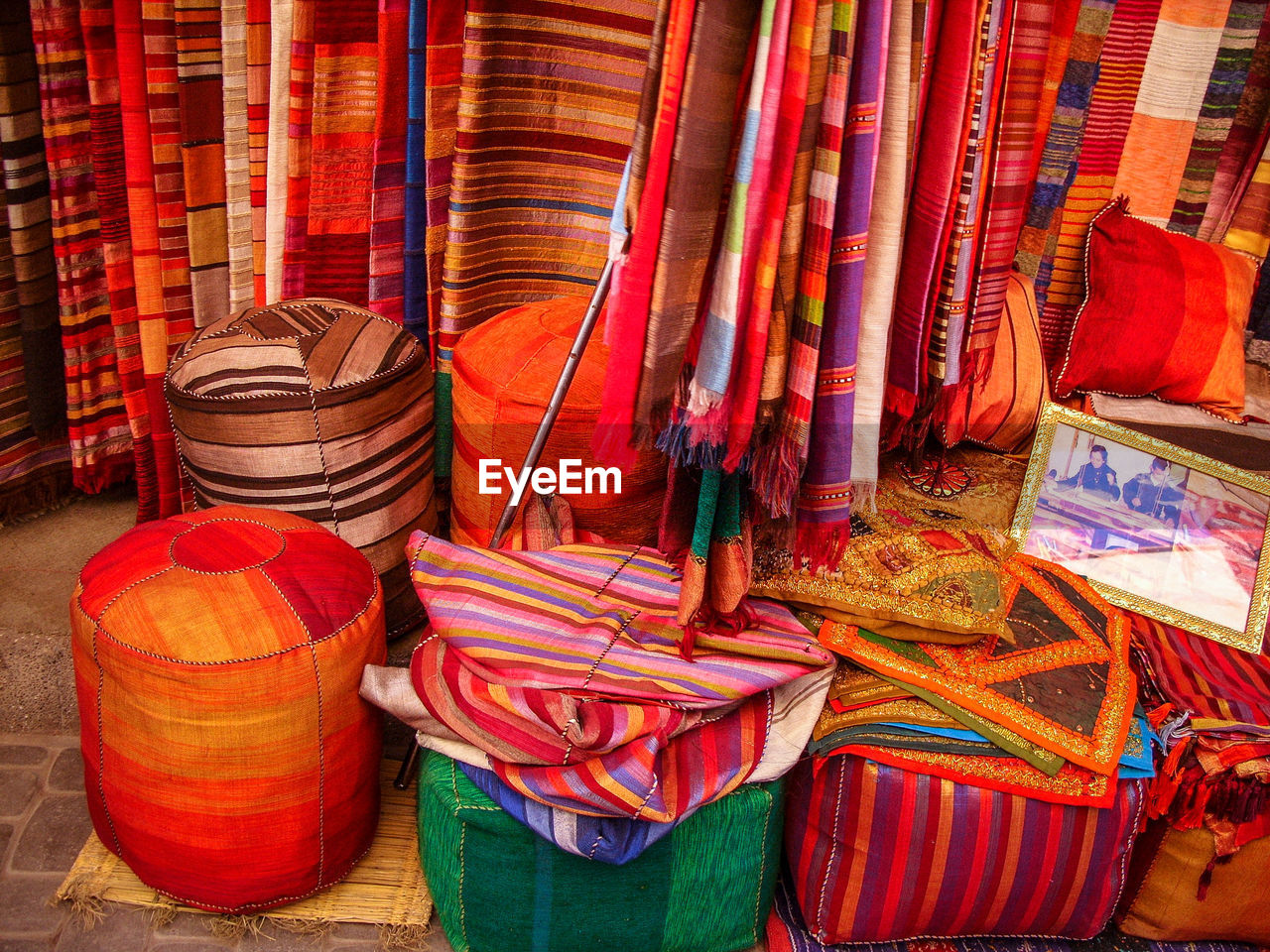 Colorful textiles for sale at market stall