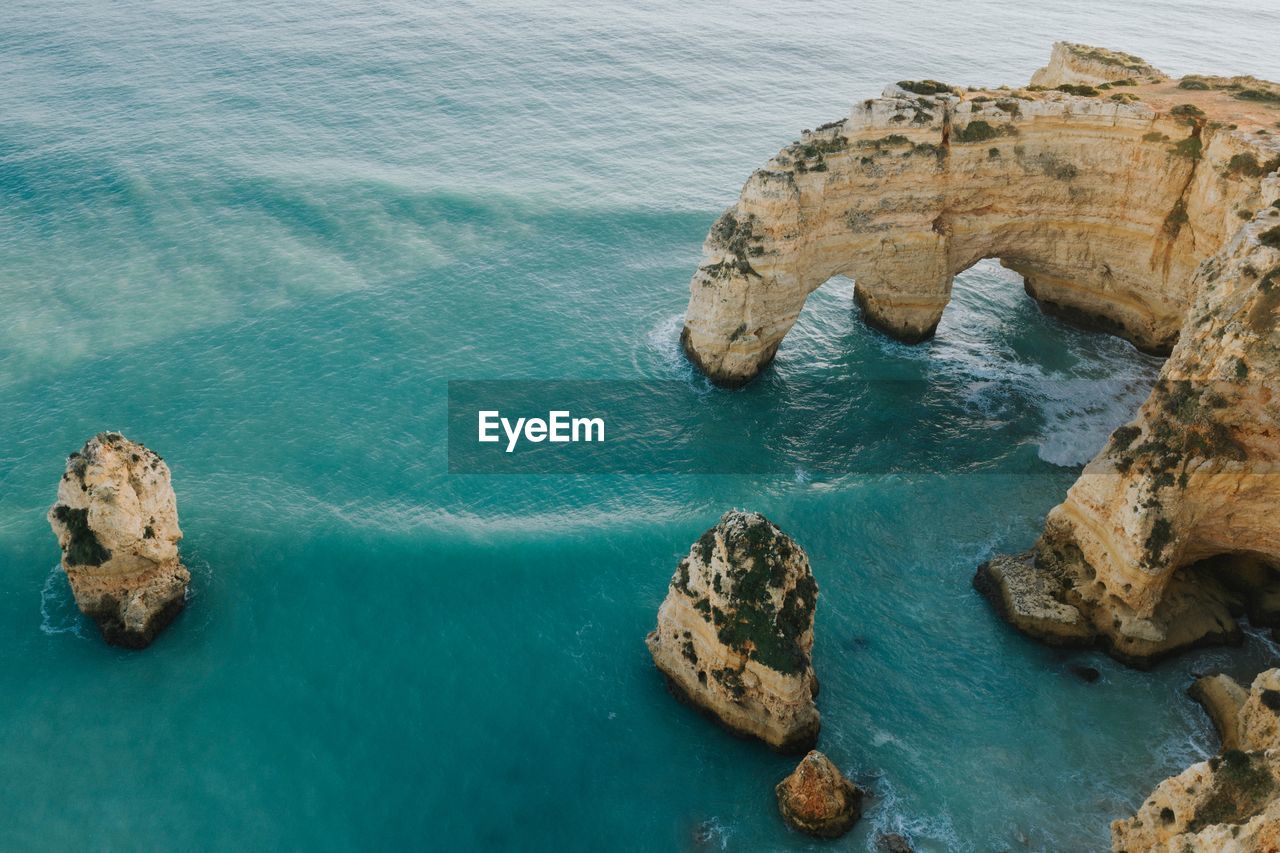 High angle view of rock formation in sea