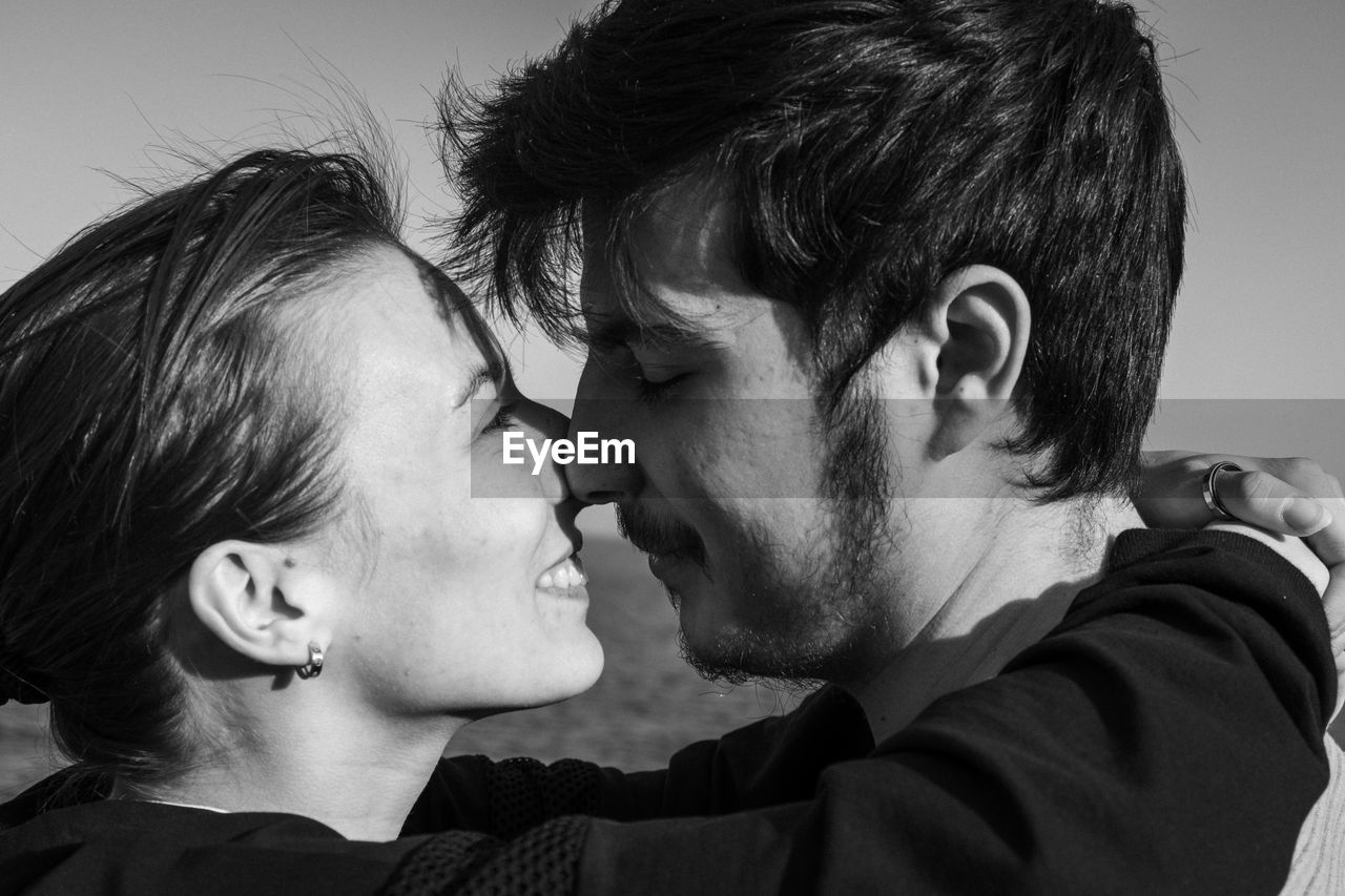 two people, togetherness, love, emotion, men, positive emotion, adult, kissing, portrait, black and white, headshot, romance, bonding, women, person, happiness, affectionate, monochrome, young adult, embracing, monochrome photography, smiling, female, indoors, lifestyles, child, black, eyes closed, human face, casual clothing, close-up