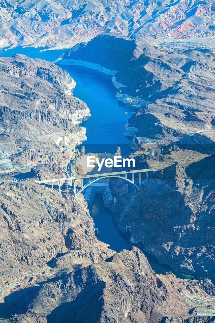 High angle view of snowcapped mountains and water - hoover dam