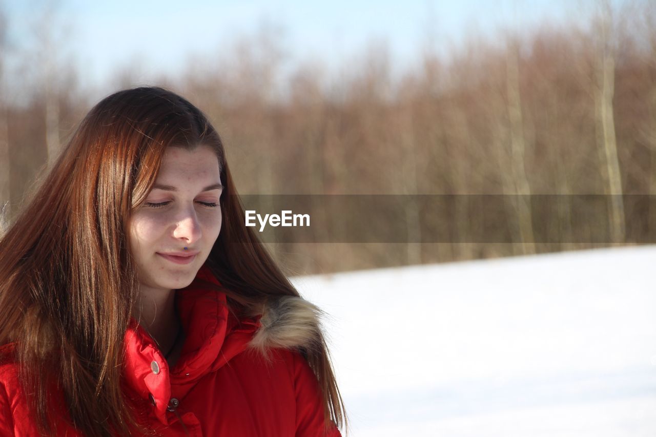 Beautiful young woman wearing warm clothing during winter