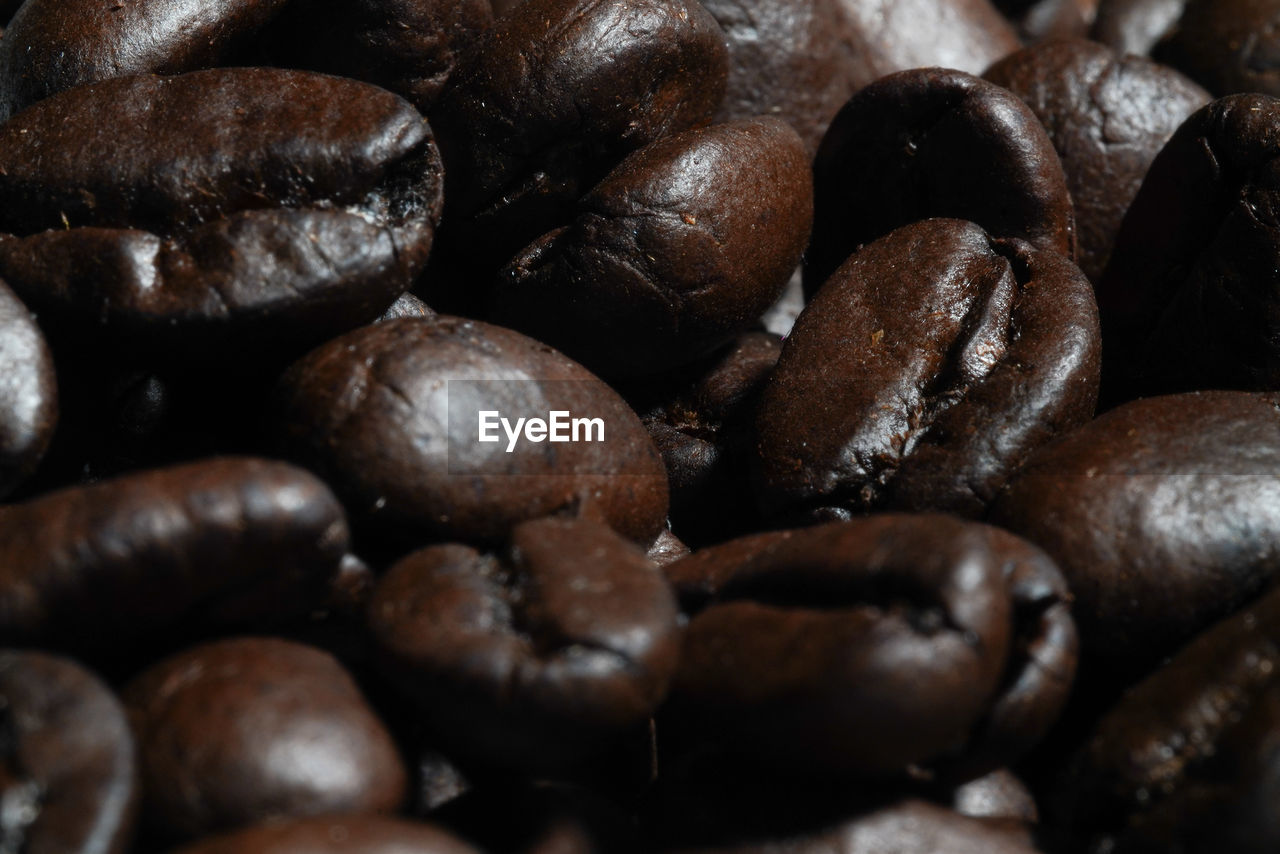 FULL FRAME SHOT OF COFFEE BEANS IN BACKGROUND