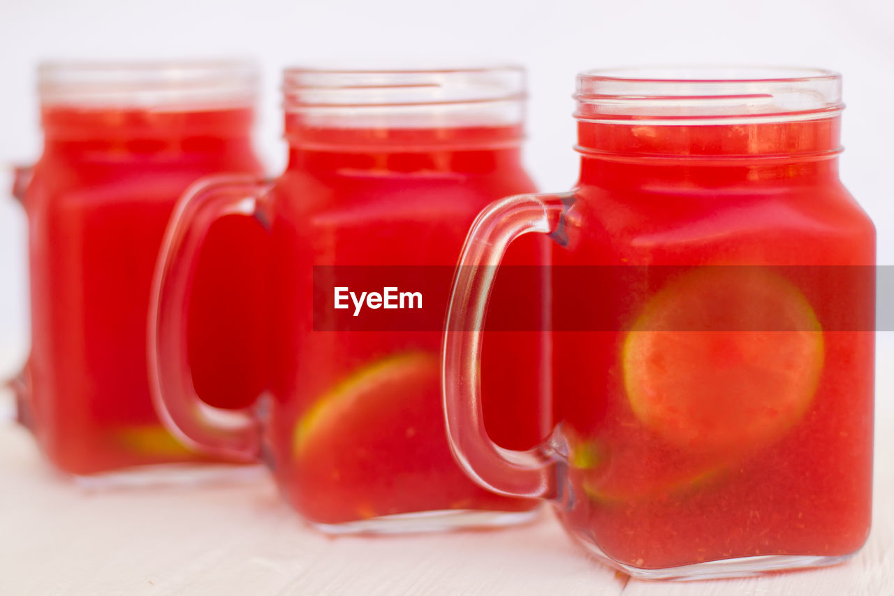 CLOSE-UP OF DRINK IN GLASS JAR