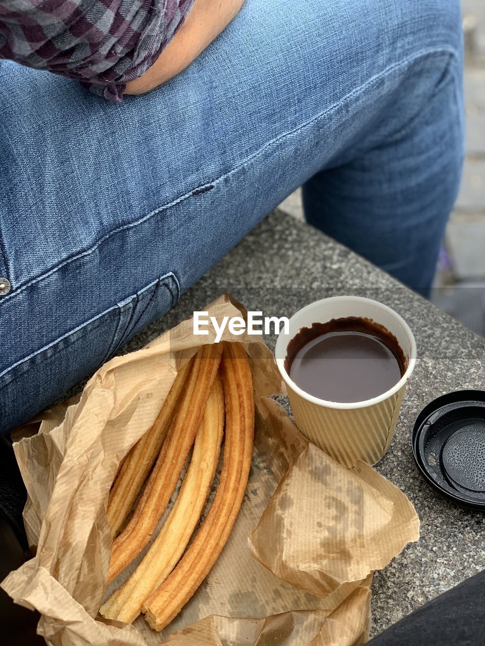 Midsection of woman with coffee