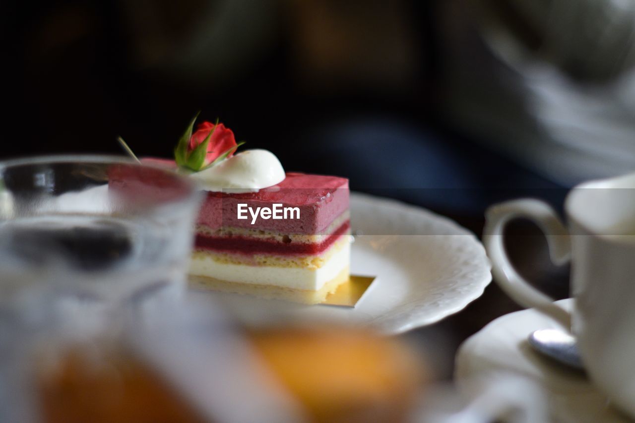 Cake slice in plate on table