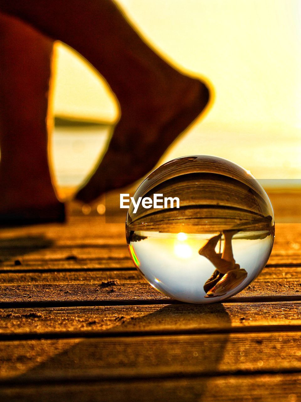 Close-up of crystal ball on wooden table