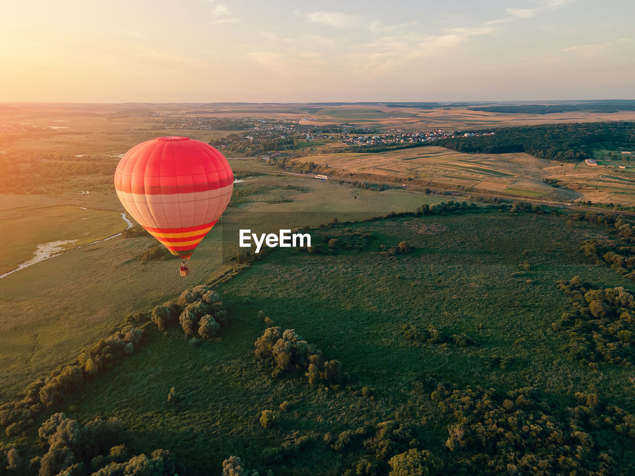 Hot air balloon flying over land