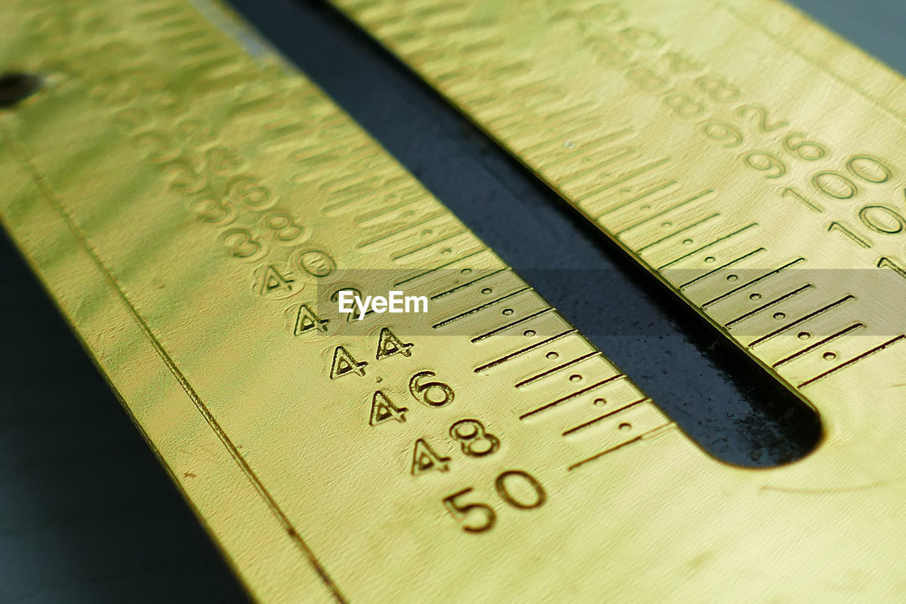 Close-up of ruler on table