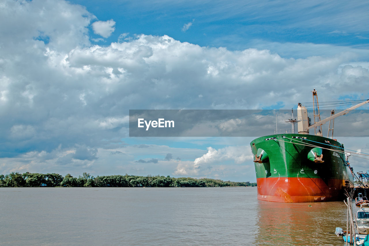 water, sea, cloud, transportation, sky, vehicle, nautical vessel, nature, ocean, mode of transportation, boat, ship, environment, watercraft, beach, travel, coast, outdoors, no people, bay, day, land, blue, industry, scenics - nature, travel destinations, cloudscape, landscape