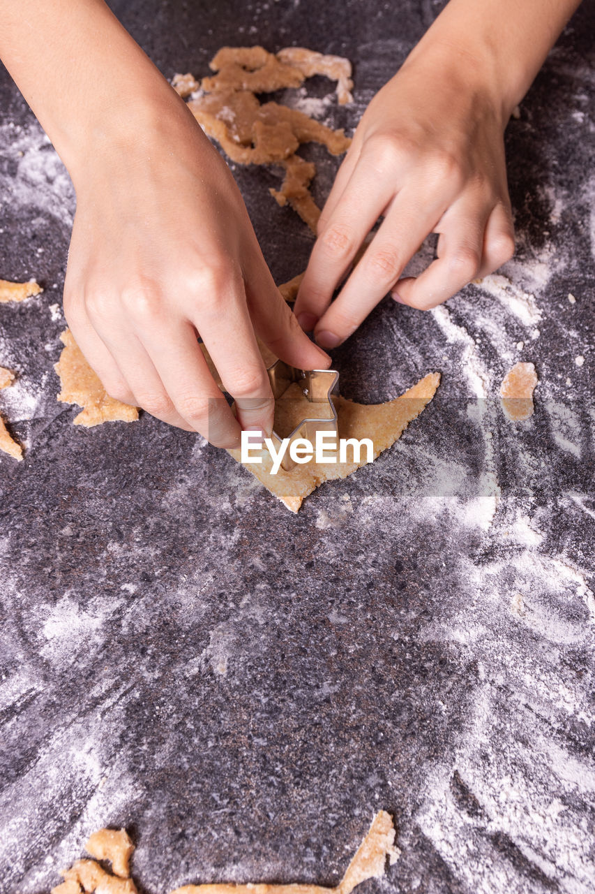 HIGH ANGLE VIEW OF WOMAN PREPARING FOOD