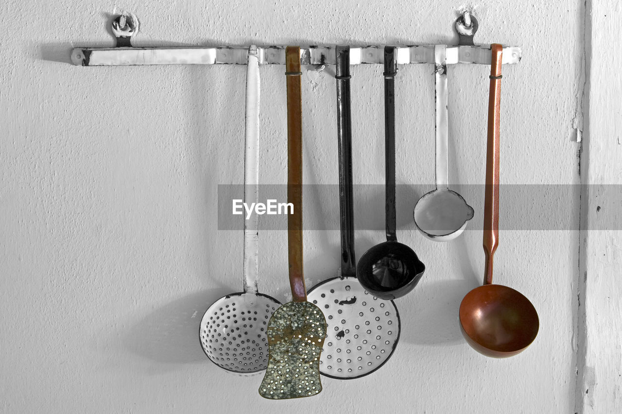 Close-up of kitchen utensils hanging