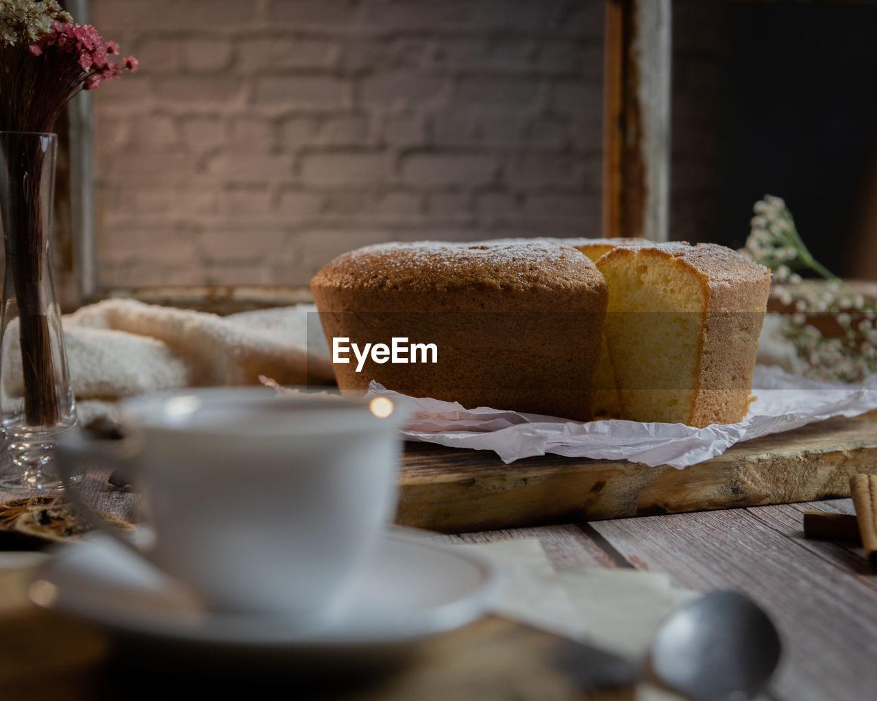 Coffee cup and cake on table