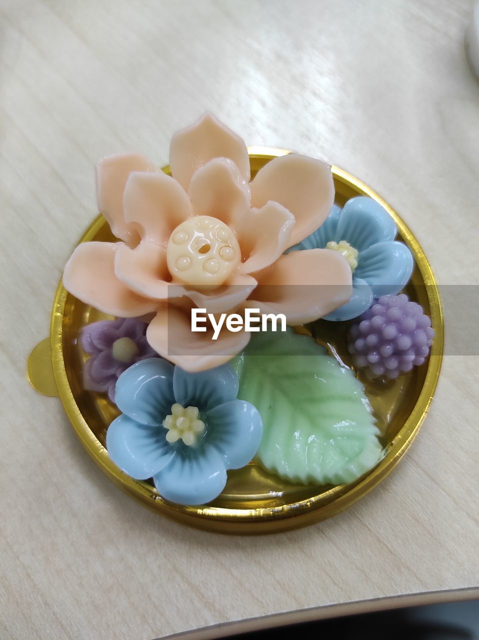 Coconut milk jelly that high angle view of various flowers in plate on table