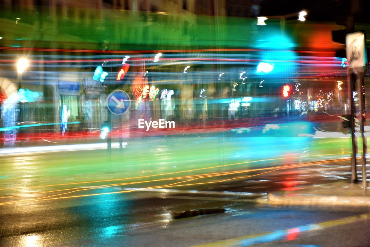 LIGHT TRAILS ON CITY STREET DURING RAINY SEASON