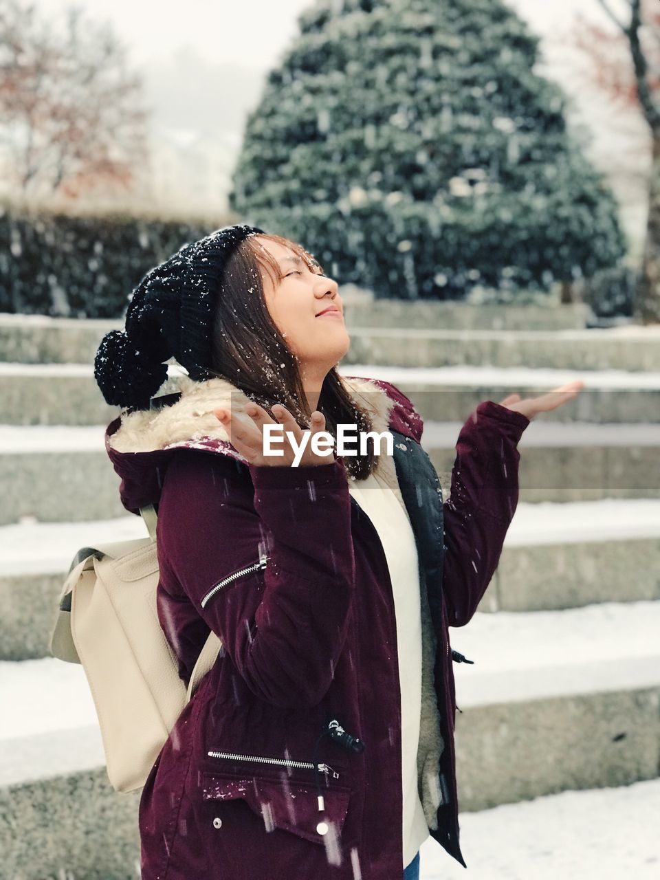Young woman enjoying in snow