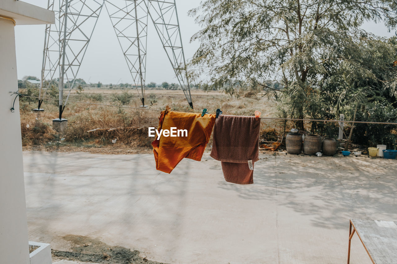 Clothes drying on clothesline against sky