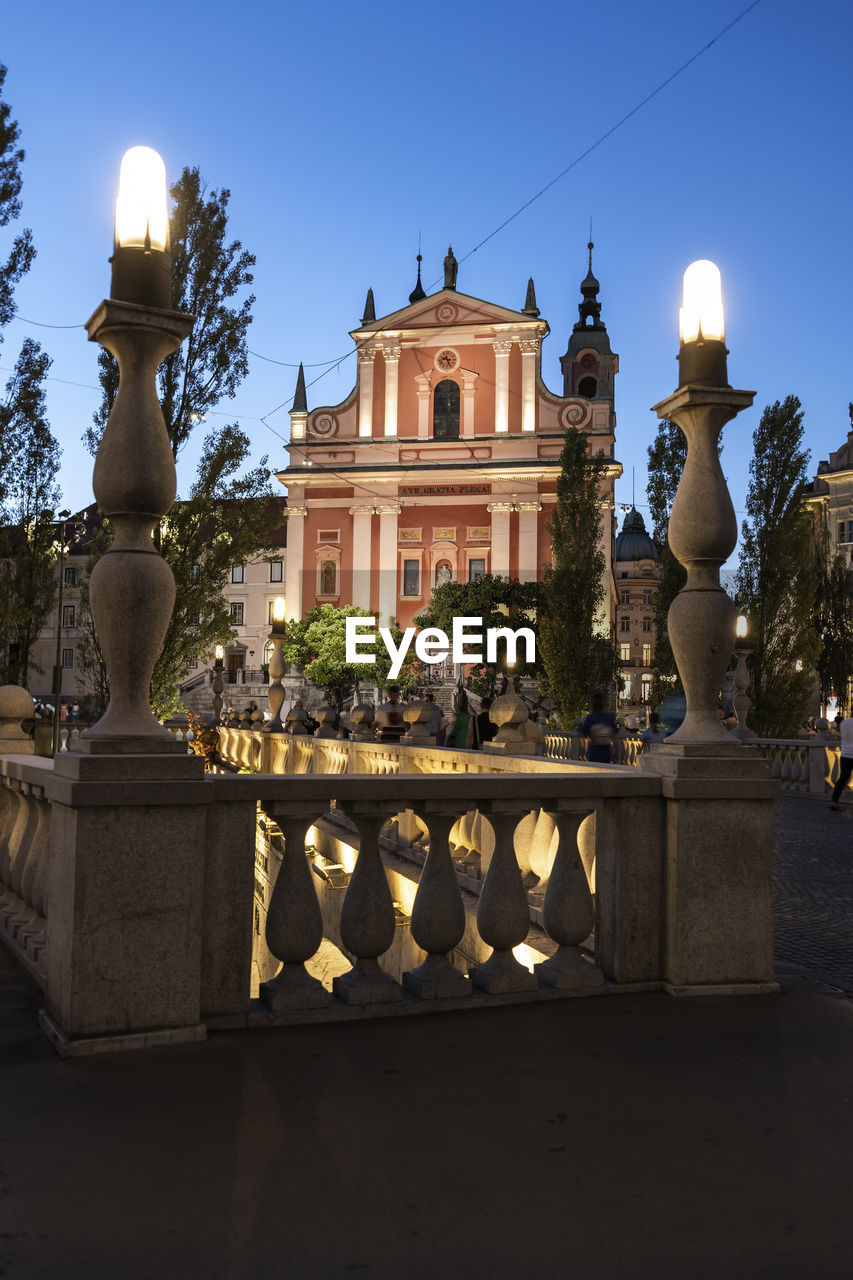 Slovenia, ljubljana, franciscan church of annunciation on preseren square at dusk