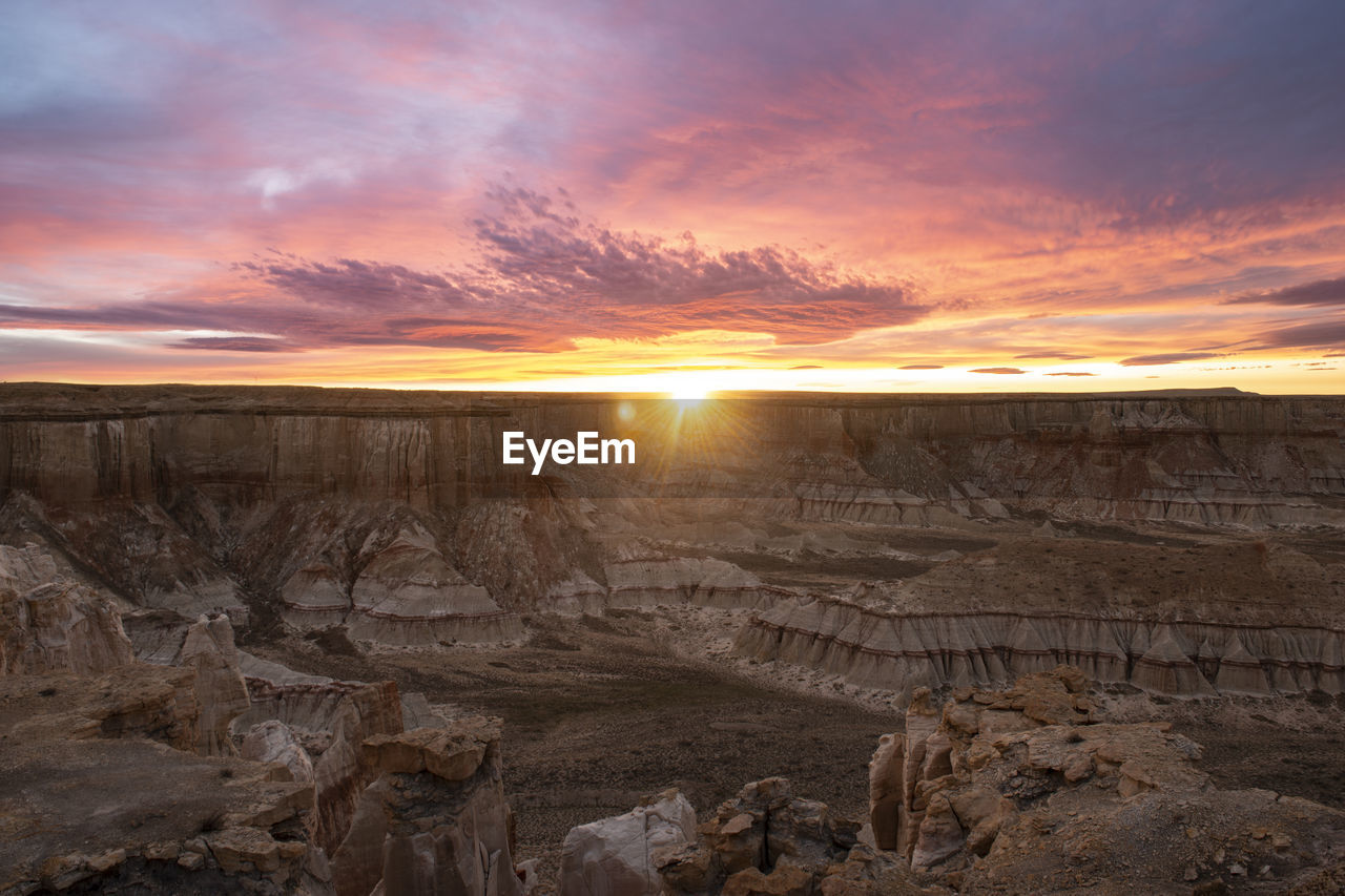 Epic sunrise aerial panorama above massive coal mine canyon on n