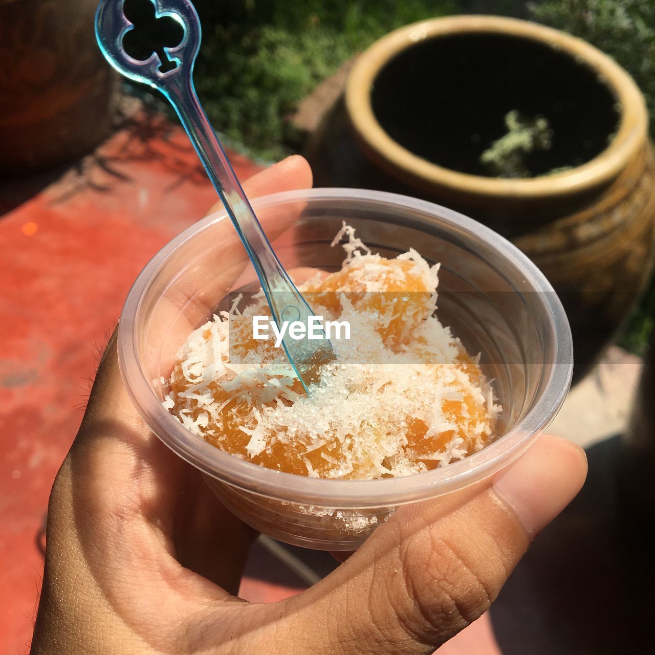 Cropped hand holding food in bowl