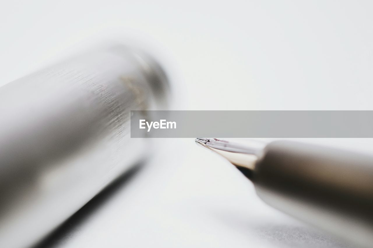 Close-up of pens on table