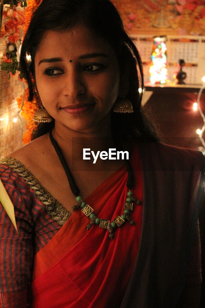 Portrait of young woman with traditional attire