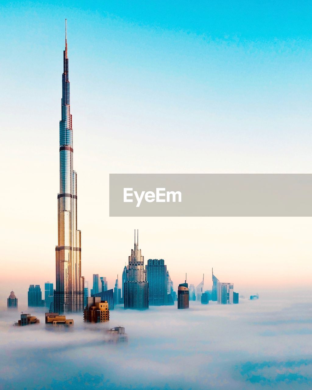 Tower and buildings against sky in city