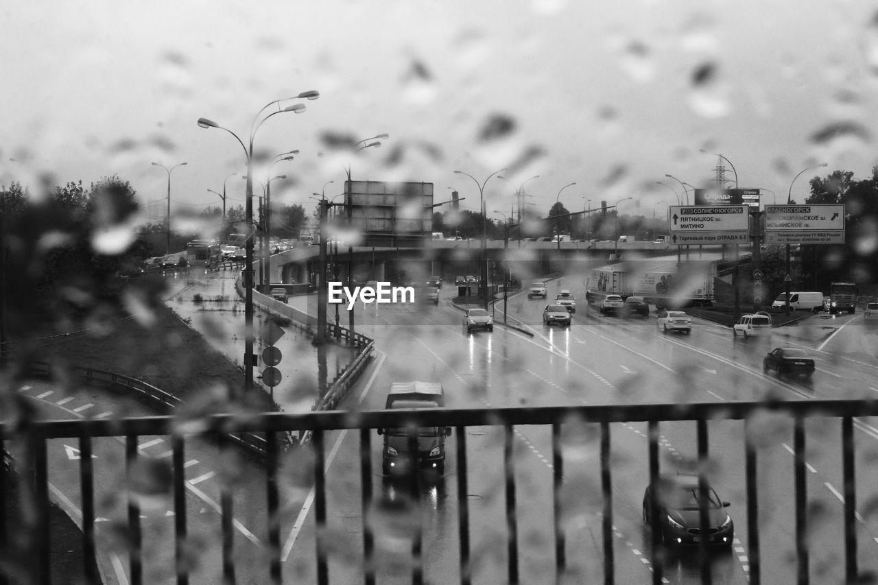 CITY SEEN THROUGH WET WINDOW