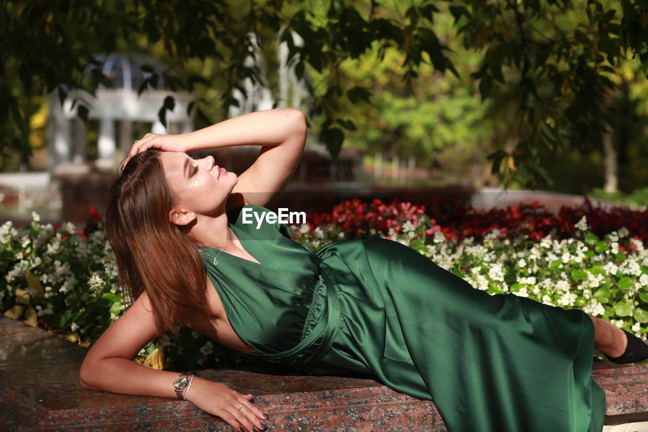 Full length of woman lying down outdoors