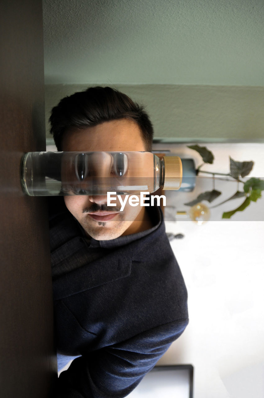 Portrait of young man with reflection
